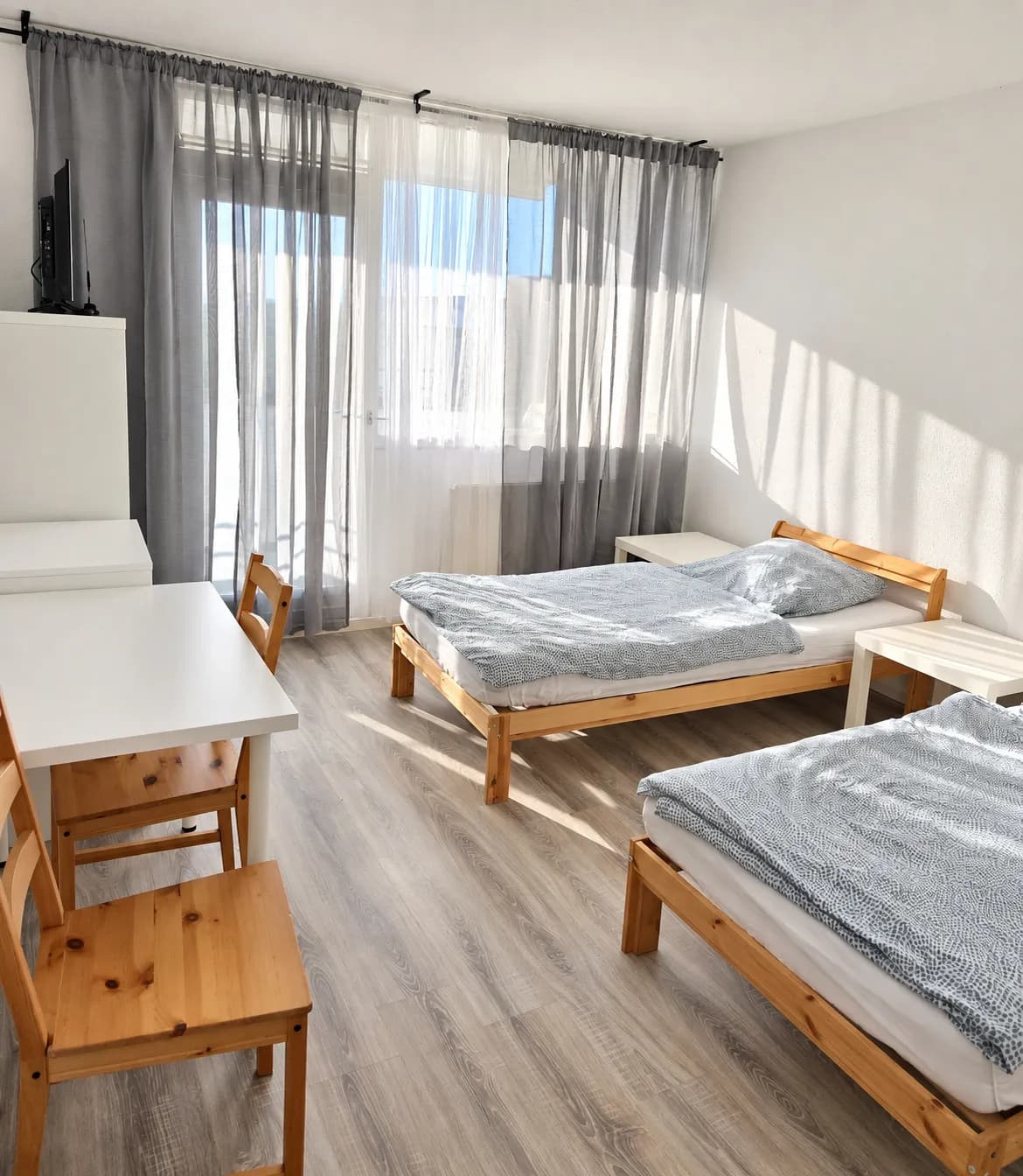 Schlafzimmer mit zwei getrennten Einzelbetten in derselben Wohnung in Bochum-Querenburg